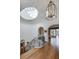 Upstairs hallway featuring a skylight, ornate iron railing, hardwood floors, and arched doorways to other rooms at 133 Blackland Nw Rd, Atlanta, GA 30342