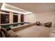 Luxury indoor pool area with a stone floor and comfortable seating for relaxation at 133 Blackland Nw Rd, Atlanta, GA 30342