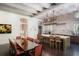 Kitchen and dining area featuring sleek countertops, designer lighting, and light wood accents at 133 Blackland Nw Rd, Atlanta, GA 30342