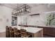 Spacious kitchen with a large island, modern lighting, and professional-grade appliances at 133 Blackland Nw Rd, Atlanta, GA 30342