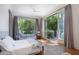 Bright bedroom with an outdoor access, hardwood floors, and neutral décor at 133 Blackland Nw Rd, Atlanta, GA 30342