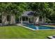 Stunning pool area with a covered outdoor living space, perfect for relaxing and entertaining at 133 Blackland Nw Rd, Atlanta, GA 30342