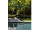Luxury pool with lounge chair on patio next to the pool at 133 Blackland Nw Rd, Atlanta, GA 30342