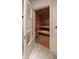 Cozy sauna featuring wood paneling and tiered benches for a spa-like experience at 133 Blackland Nw Rd, Atlanta, GA 30342