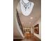 View of the gracefully curved staircase with decorative metalwork and bright entryway at 133 Blackland Nw Rd, Atlanta, GA 30342