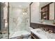 Modern bathroom with marble shower and a stylish vanity at 2575 Peachtree Ne Rd # 9G, Atlanta, GA 30305