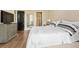 Spacious bedroom with hardwood floors and access to a private balcony at 2575 Peachtree Ne Rd # 9G, Atlanta, GA 30305
