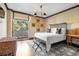 Charming bedroom with unique decor and private balcony access at 2575 Peachtree Ne Rd # 9G, Atlanta, GA 30305