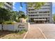 Plaza Towers building entrance with landscaping at 2575 Peachtree Ne Rd # 9G, Atlanta, GA 30305