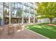 Brick courtyard with artificial turf and seating at 2575 Peachtree Ne Rd # 9G, Atlanta, GA 30305