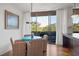 Bright dining area with turquoise table and access to balcony at 2575 Peachtree Ne Rd # 9G, Atlanta, GA 30305