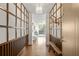 Elegant entryway with wood flooring, built-in shelving, and a bench at 2575 Peachtree Ne Rd # 9G, Atlanta, GA 30305