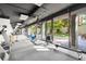 Fitness center with various equipment and access to a patio at 2575 Peachtree Ne Rd # 9G, Atlanta, GA 30305
