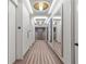 Modern hallway with patterned carpet and large mirrors at 2575 Peachtree Ne Rd # 9G, Atlanta, GA 30305