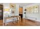 Bright home office with wood desk, art, and herringbone floors at 2575 Peachtree Ne Rd # 9G, Atlanta, GA 30305