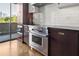 Modern kitchen with stainless steel appliances and hardwood floors at 2575 Peachtree Ne Rd # 9G, Atlanta, GA 30305