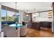 Modern kitchen with dark cabinetry, white backsplash, and island at 2575 Peachtree Ne Rd # 9G, Atlanta, GA 30305