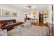 Living room with brown sofa, glass coffee table, and patterned rug at 2575 Peachtree Ne Rd # 9G, Atlanta, GA 30305