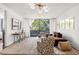 Spacious living room with large windows and comfortable seating at 2575 Peachtree Ne Rd # 9G, Atlanta, GA 30305