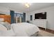 Bright bedroom with large TV and dresser at 16 Ivy Ne Rdg, Atlanta, GA 30342