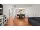 Bright dining room features hardwood floors and a large wooden table with seating for six at 16 Ivy Ne Rdg, Atlanta, GA 30342