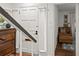 Entryway with white door, built-in shelving, and view of sitting area at 16 Ivy Ne Rdg, Atlanta, GA 30342