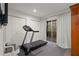 Bright home gym with treadmill and ample space at 16 Ivy Ne Rdg, Atlanta, GA 30342