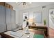 Bright home office with built-in cabinets, a large desk, and comfortable seating at 16 Ivy Ne Rdg, Atlanta, GA 30342