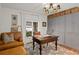Bright home office with built-in cabinets, a large desk, and comfortable seating at 16 Ivy Ne Rdg, Atlanta, GA 30342