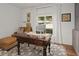 Bright home office with built-in cabinets, a large desk, and comfortable seating at 16 Ivy Ne Rdg, Atlanta, GA 30342
