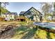 Spacious backyard with a deck, trampoline, and mature trees at 2508 Connally Dr, East Point, GA 30344
