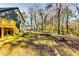 Large backyard with deck, trampoline and mature trees providing shade at 2508 Connally Dr, East Point, GA 30344