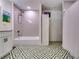 Bathroom with a shower/tub combo and geometric tile floor at 2508 Connally Dr, East Point, GA 30344