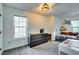 Spacious bedroom with a dresser, TV and window at 2508 Connally Dr, East Point, GA 30344