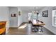 Bright dining room with a long wooden table and modern chandelier at 2508 Connally Dr, East Point, GA 30344