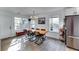 Spacious dining area features wood table, light flooring, and natural light at 2508 Connally Dr, East Point, GA 30344