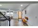 Light-filled entryway, hardwood floors, and built-in bench at 2508 Connally Dr, East Point, GA 30344