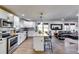 Modern kitchen with white cabinets, stainless steel appliances and breakfast bar at 2508 Connally Dr, East Point, GA 30344