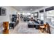 Open concept living room with hardwood floors, sectional sofa and large TV at 2508 Connally Dr, East Point, GA 30344