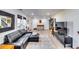 Spacious living area with hardwood floors, sectional sofa, and large windows at 2508 Connally Dr, East Point, GA 30344