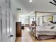 Large main bedroom with a king-size bed and a beautiful metal frame at 2508 Connally Dr, East Point, GA 30344