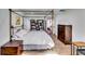 Spacious main bedroom with king bed, wooden furniture, and natural light at 2508 Connally Dr, East Point, GA 30344