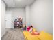 Versatile bonus room with plush carpeting, perfect for a playroom or additional storage at 319 Pinewood Dr, Woodstock, GA 30189