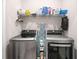 Functional laundry room with modern stainless steel washer and dryer and wire shelving at 319 Pinewood Dr, Woodstock, GA 30189
