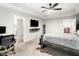 Open bedroom with a ceiling fan, a workstation, and access to the bathroom and closet at 319 Pinewood Dr, Woodstock, GA 30189