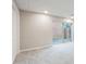 Finished basement with neutral carpeting and sliding door at 790 Oakhaven Dr, Roswell, GA 30075