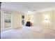 Large bedroom with wall-to-wall carpet, ample natural light, and a ceiling fan at 790 Oakhaven Dr, Roswell, GA 30075