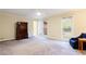 Spacious bedroom with carpeting, large windows, and ceiling fan at 790 Oakhaven Dr, Roswell, GA 30075