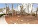 Brick house with mature trees and a long driveway at 790 Oakhaven Dr, Roswell, GA 30075