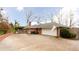 Brick home with attached garage and large driveway at 790 Oakhaven Dr, Roswell, GA 30075